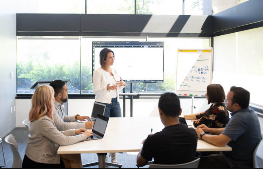 Founders discussing investment strategies in a studio